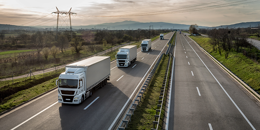 Trucks driving in a line on a highway