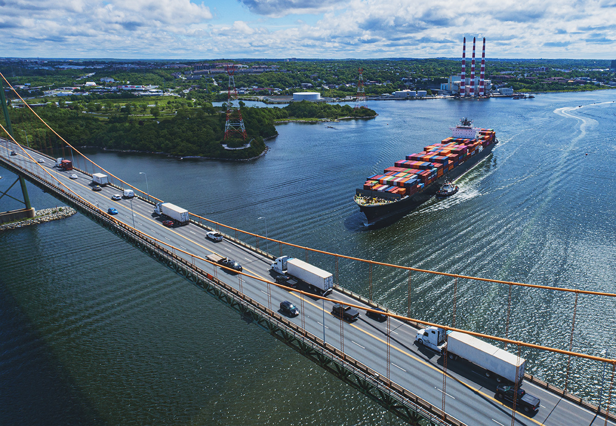 Cargo ship about to cross under a bridge