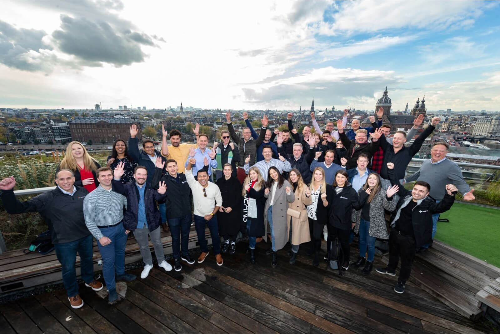 FourKites team cheering on a rooftop in Europe